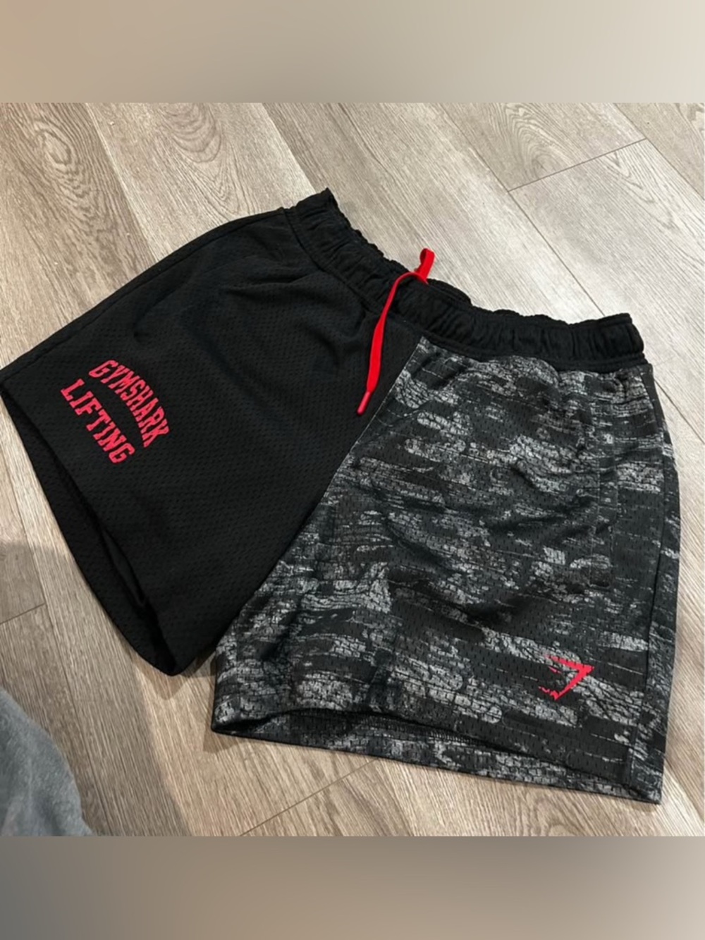 Gymshark Men’s Black & Gray Split-Panel Athletic Shorts with Red Accents